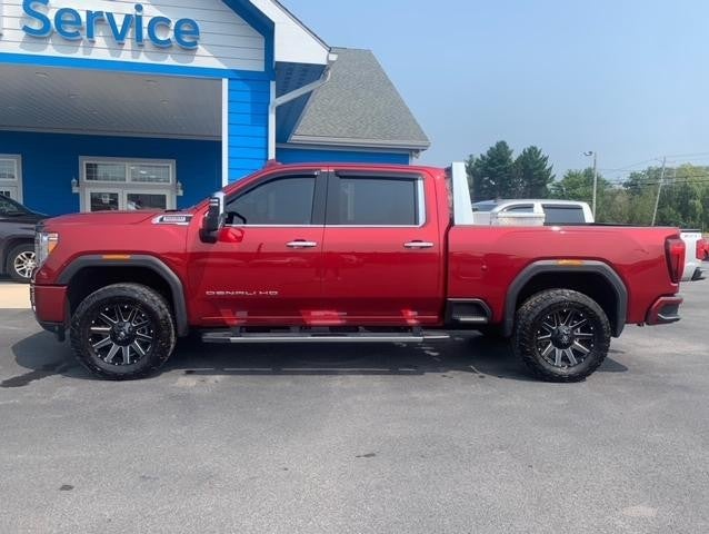 Side view of Red GMC Denali | Rough Country and Fuel Accessories | Parkway Chevrolet | CANTON, NY